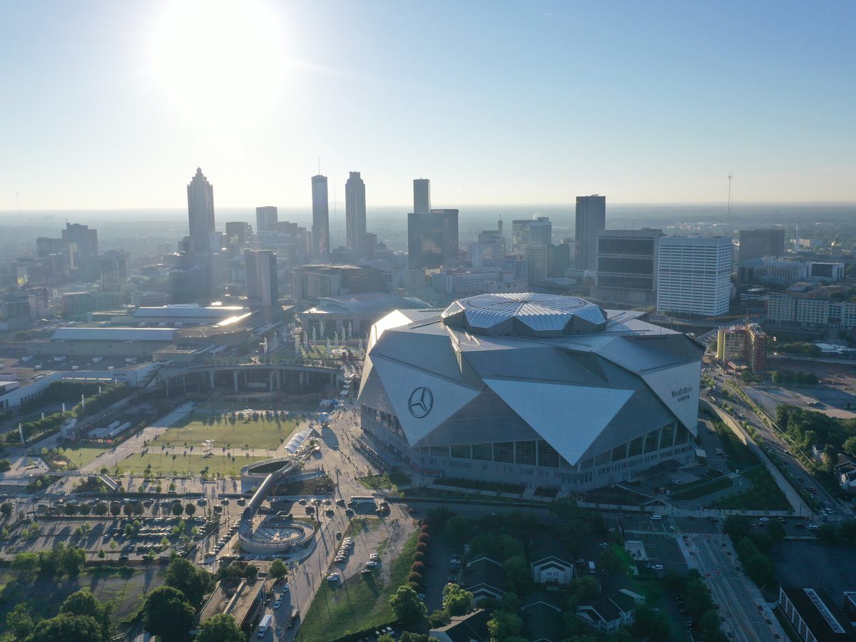Aerial view of Mercedes-Benz Stadium and the downtown Atlanta skyline