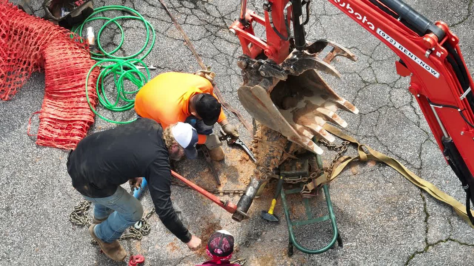 Overhead view of a crew working around a drill rig on a utility job