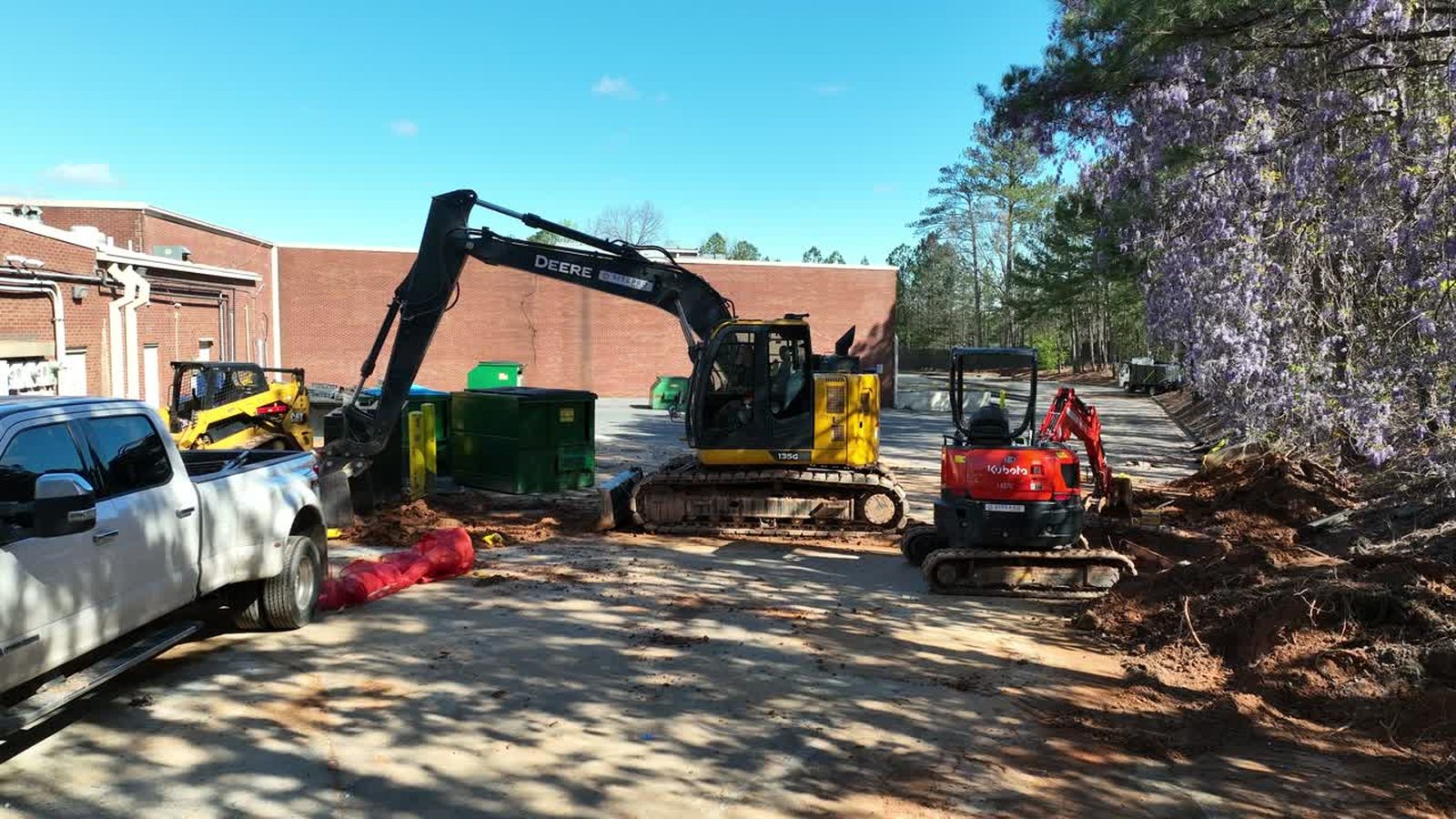 Heavy equipment clearing land on a large utility scale site