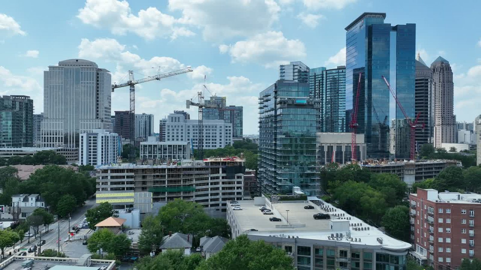 Tower cranes over a Midtown Atlanta construction site seen from the air