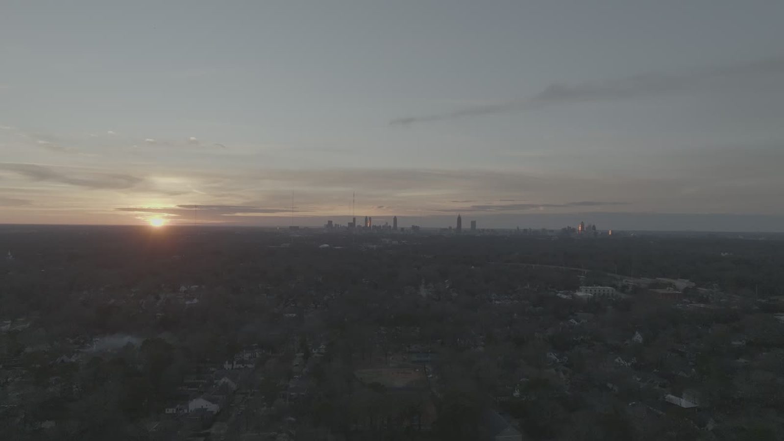 Heat haze over the Atlanta treeline at sunset in midsummer